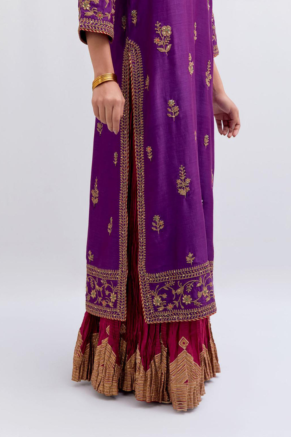 Purple Silk Chanderi straight kurta set with dull gold dori embroidery at front & back neck, sleeves, side slits and hem, highlighted with gold sequins and bead work.