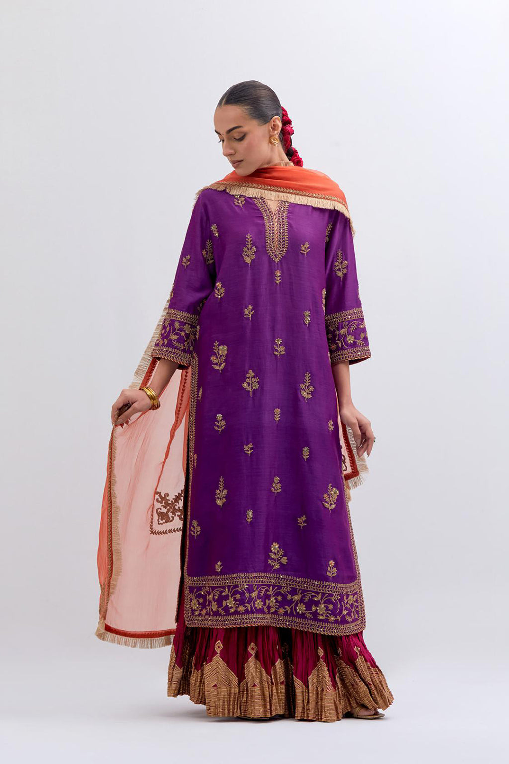 Purple Silk Chanderi straight kurta set with dull gold dori embroidery at front & back neck, sleeves, side slits and hem, highlighted with gold sequins and bead work.