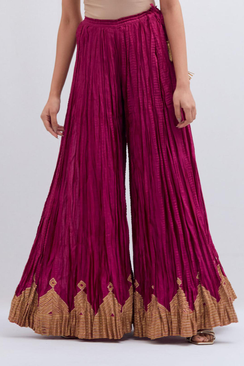 Deep Fuchsia Silk Chanderi crushed sharara, highlighted with dull gold gota border.