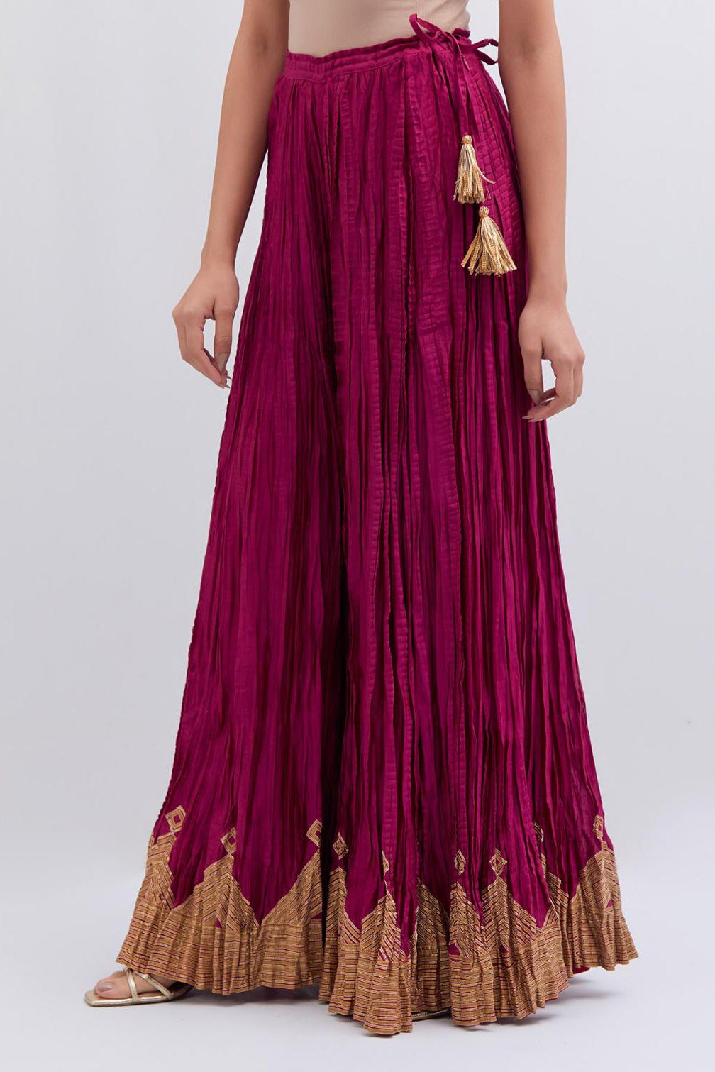 Deep Fuchsia Silk Chanderi crushed sharara, highlighted with dull gold gota border.