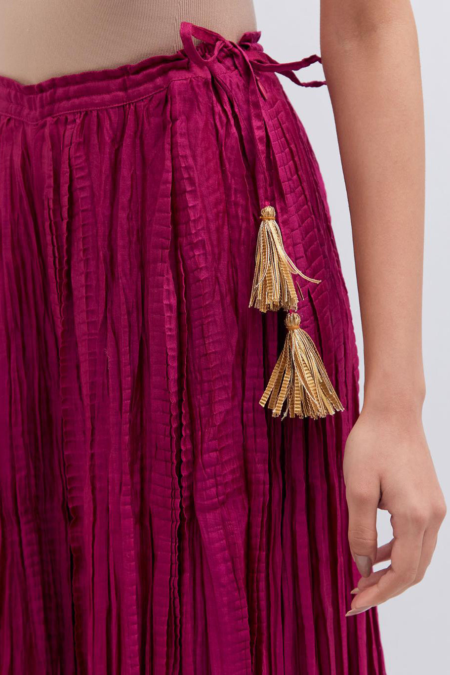 Deep Fuchsia Silk Chanderi crushed sharara, highlighted with dull gold gota border.