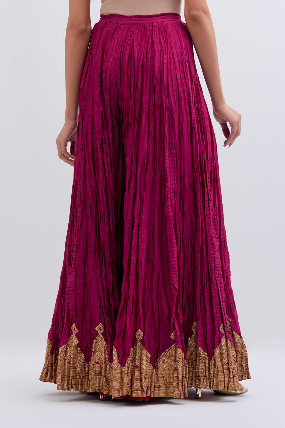 Deep Fuchsia Silk Chanderi crushed sharara, highlighted with dull gold gota border.