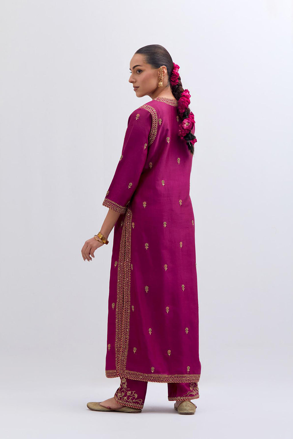 Fuchsia Silk Chanderi straight kurta set with narrow border dull gold dori embroidery at front & back neck, sleeves, side slits and hem, highlighted with gold sequins and bead work.