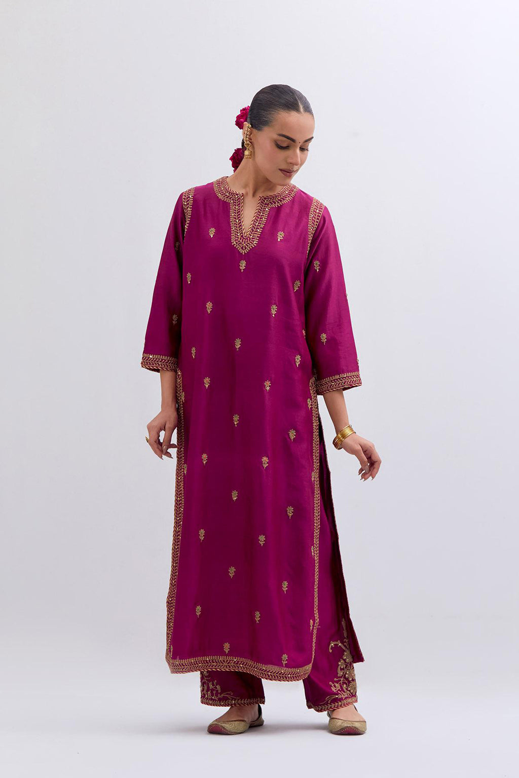 Fuchsia Silk Chanderi straight kurta set with narrow border dull gold dori embroidery at front & back neck, sleeves, side slits and hem, highlighted with gold sequins and bead work.