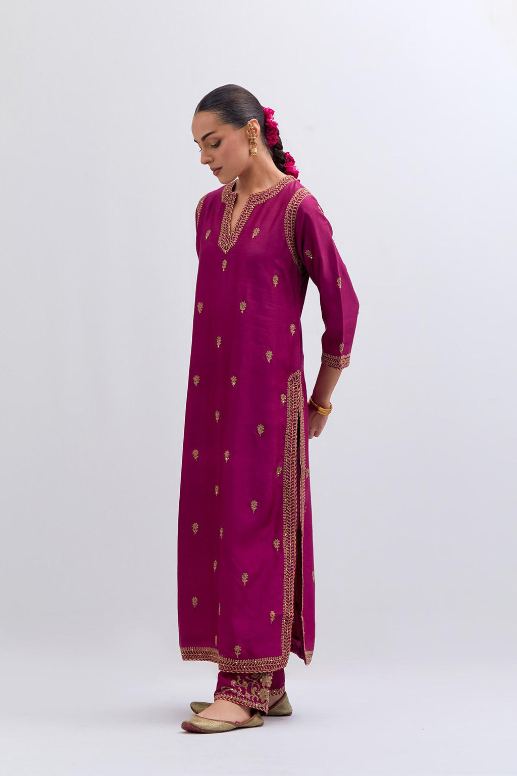 Fuchsia Silk Chanderi straight kurta set with narrow border dull gold dori embroidery at front & back neck, sleeves, side slits and hem, highlighted with gold sequins and bead work.