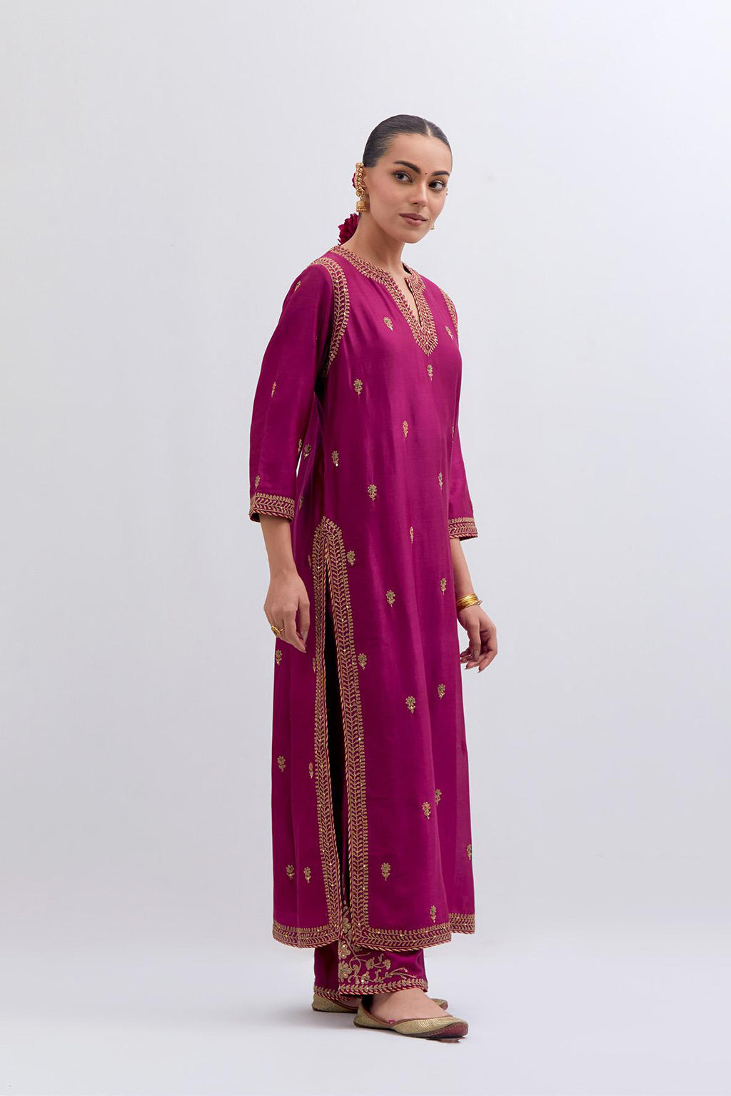 Fuchsia Silk Chanderi straight kurta set with narrow border dull gold dori embroidery at front & back neck, sleeves, side slits and hem, highlighted with gold sequins and bead work.