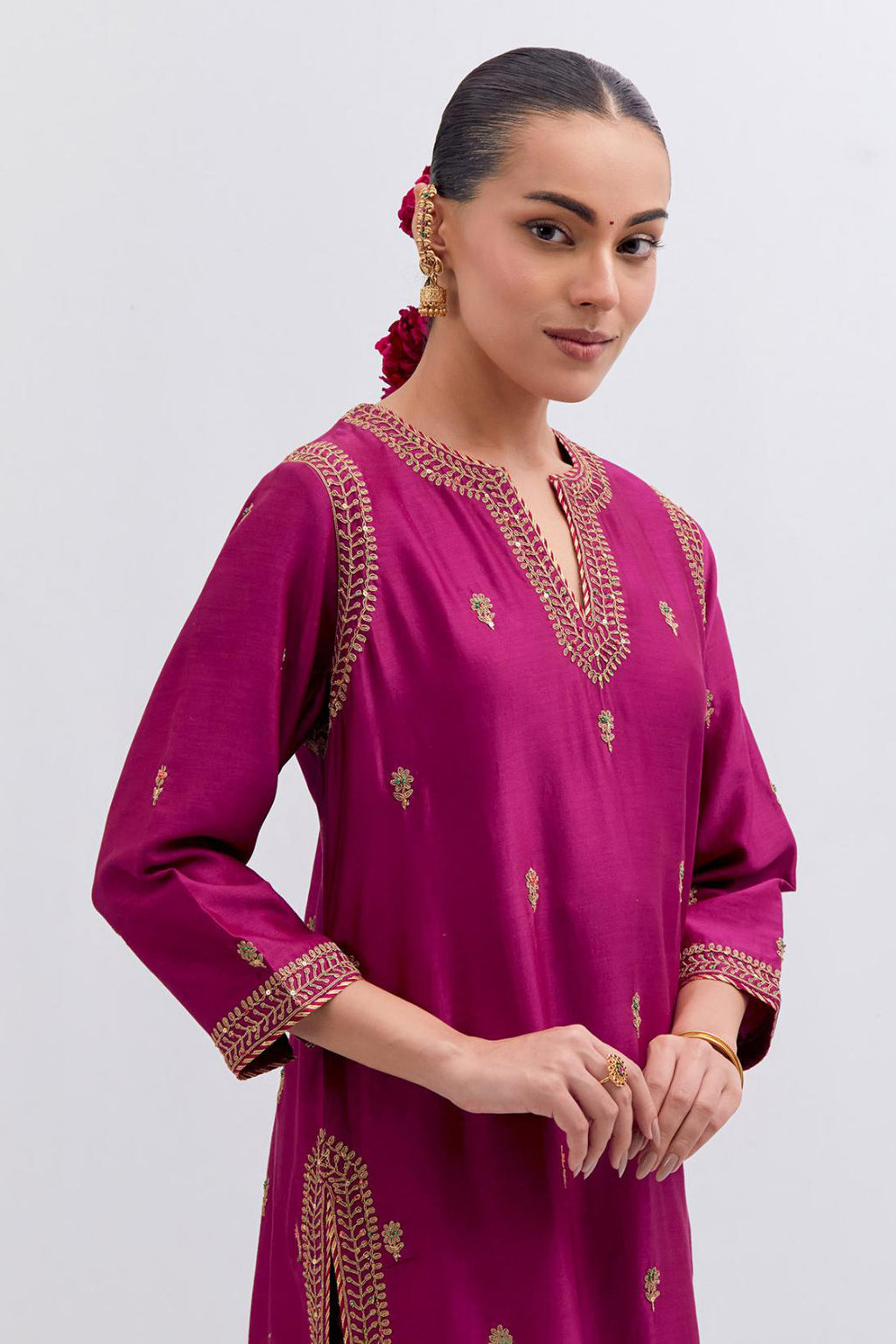 Fuchsia Silk Chanderi straight kurta set with narrow border dull gold dori embroidery at front & back neck, sleeves, side slits and hem, highlighted with gold sequins and bead work.