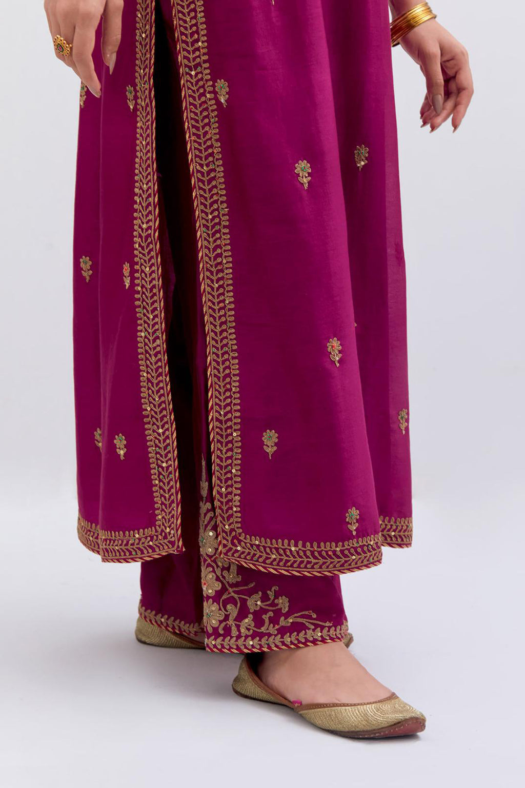 Fuchsia Silk Chanderi straight kurta set with narrow border dull gold dori embroidery at front & back neck, sleeves, side slits and hem, highlighted with gold sequins and bead work.