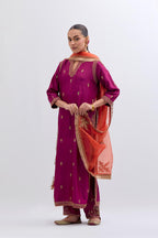 Fuchsia Silk Chanderi straight kurta set with narrow border dull gold dori embroidery at front & back neck, sleeves, side slits and hem, highlighted with gold sequins and bead work.