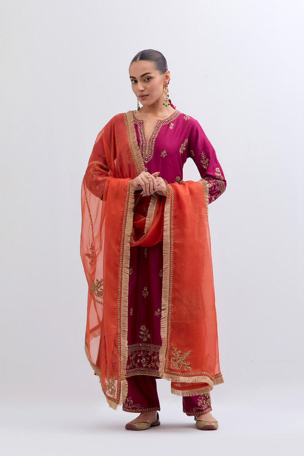 Fuchsia Silk Chanderi straight kurta set with dull gold dori embroidery at front & back neck, sleeves, side slits and hem, highlighted with gold sequins and bead work.