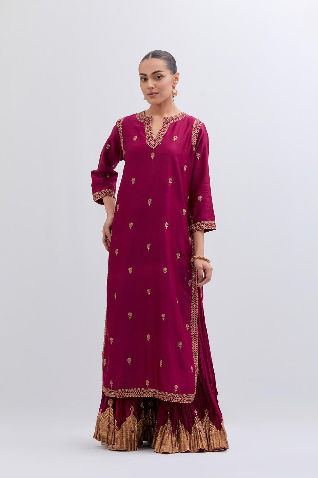 Fuchsia Silk Chanderi straight kurta set with narrow border dull gold dori embroidery at front & back neck, sleeves, side slits and hem, highlighted with gold sequins and bead work.