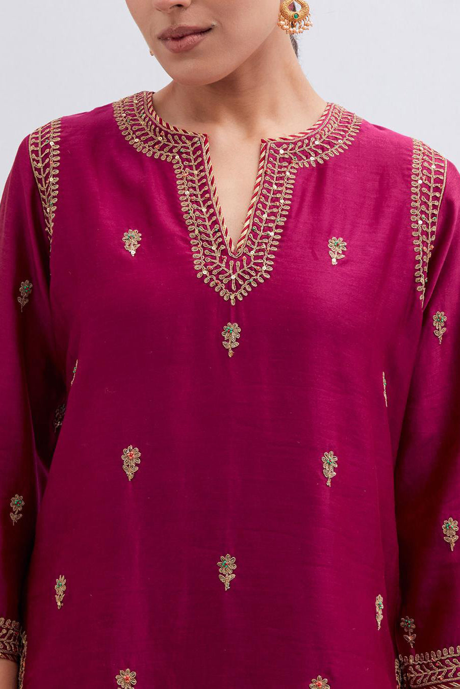 Fuchsia Silk Chanderi straight kurta set with narrow border dull gold dori embroidery at front & back neck, sleeves, side slits and hem, highlighted with gold sequins and bead work.