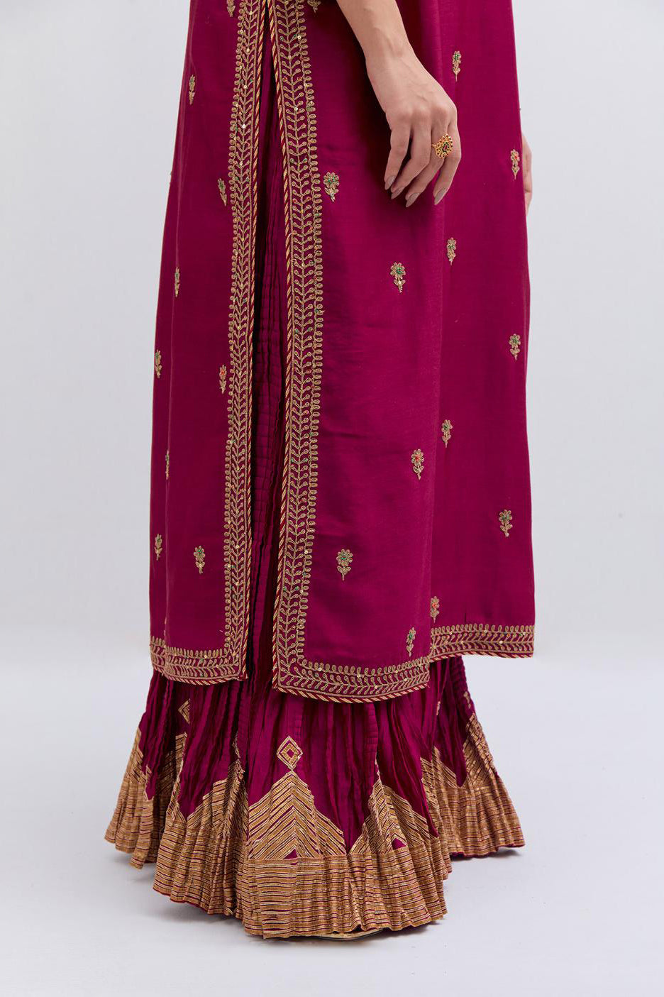 Fuchsia Silk Chanderi straight kurta set with narrow border dull gold dori embroidery at front & back neck, sleeves, side slits and hem, highlighted with gold sequins and bead work.