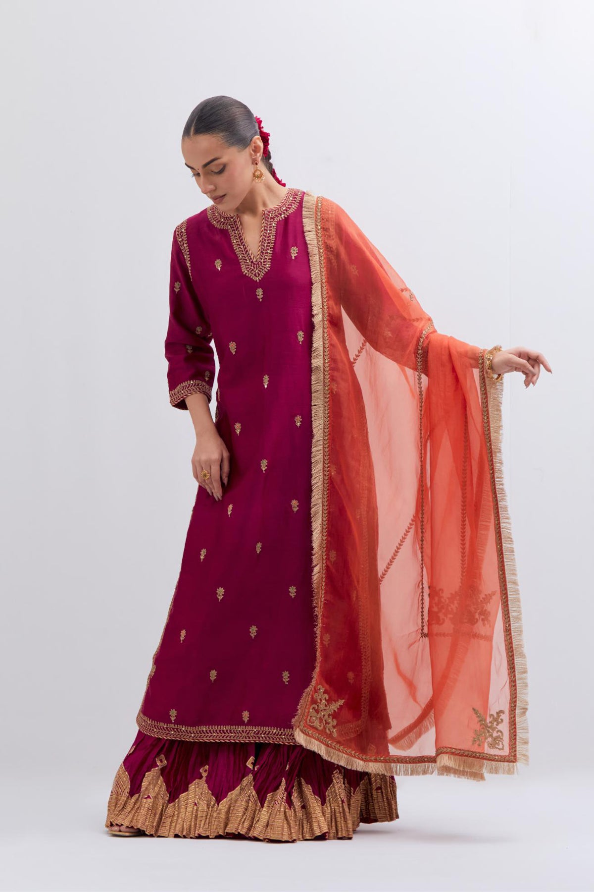 Orange Silk Organza dupatta detailed with all-over dull gold dori embroidery, highlighted with multi colored beads and gold sequins work.