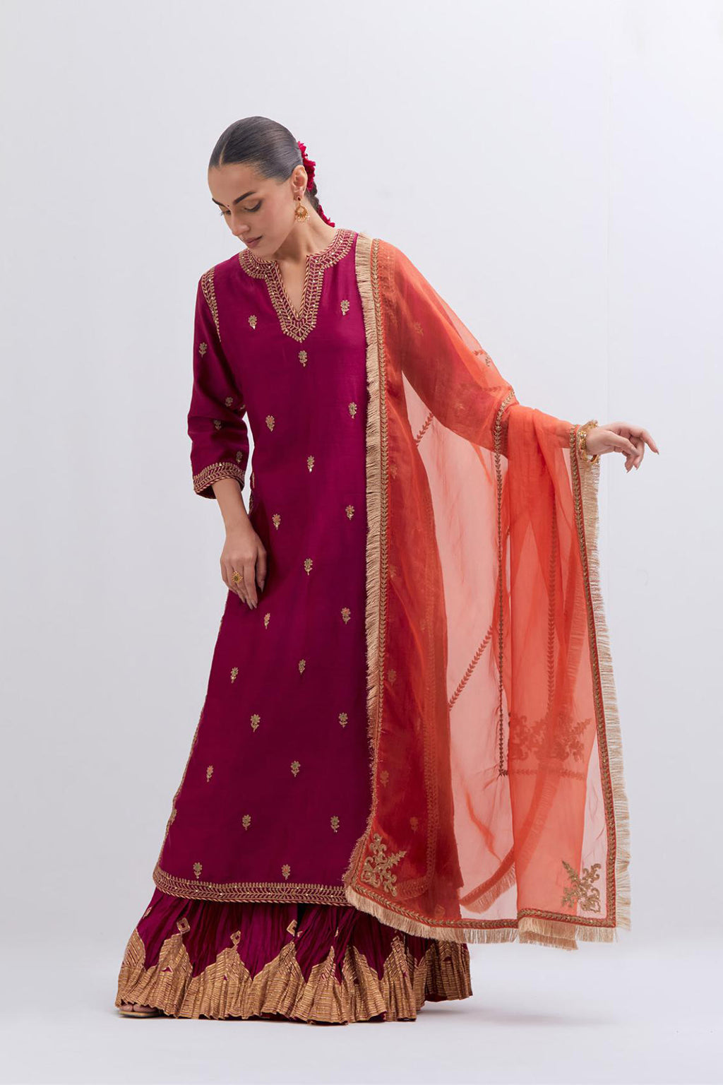 Fuchsia Silk Chanderi straight kurta set with narrow border dull gold dori embroidery at front & back neck, sleeves, side slits and hem, highlighted with gold sequins and bead work.