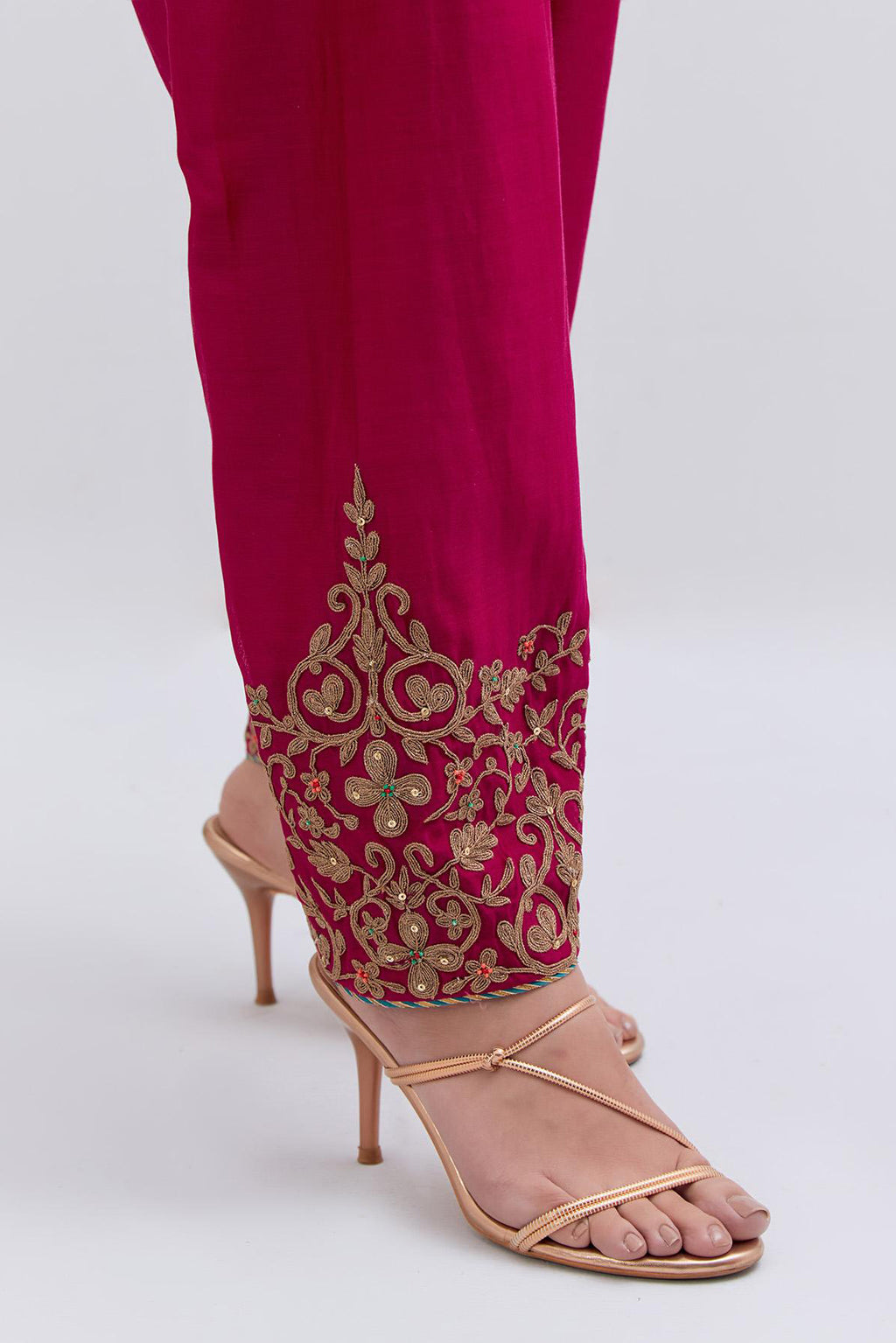 Fuchsia Silk Chanderi narrow salwar with light gold dori embroidery at hem, highlighted with multi colored beads and gold sequins work.