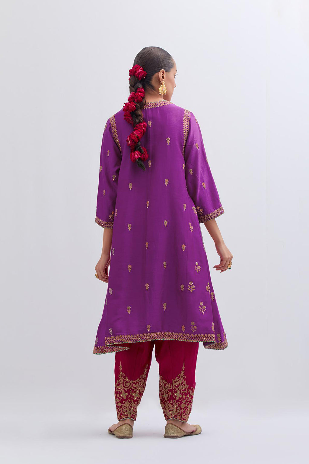 Purple Silk Chanderi A-line short kurta set with dull gold dori embroidery at neck, 3/4 sleeves, pockets and hem, highlighted with multi colored beads and gold sequins work.