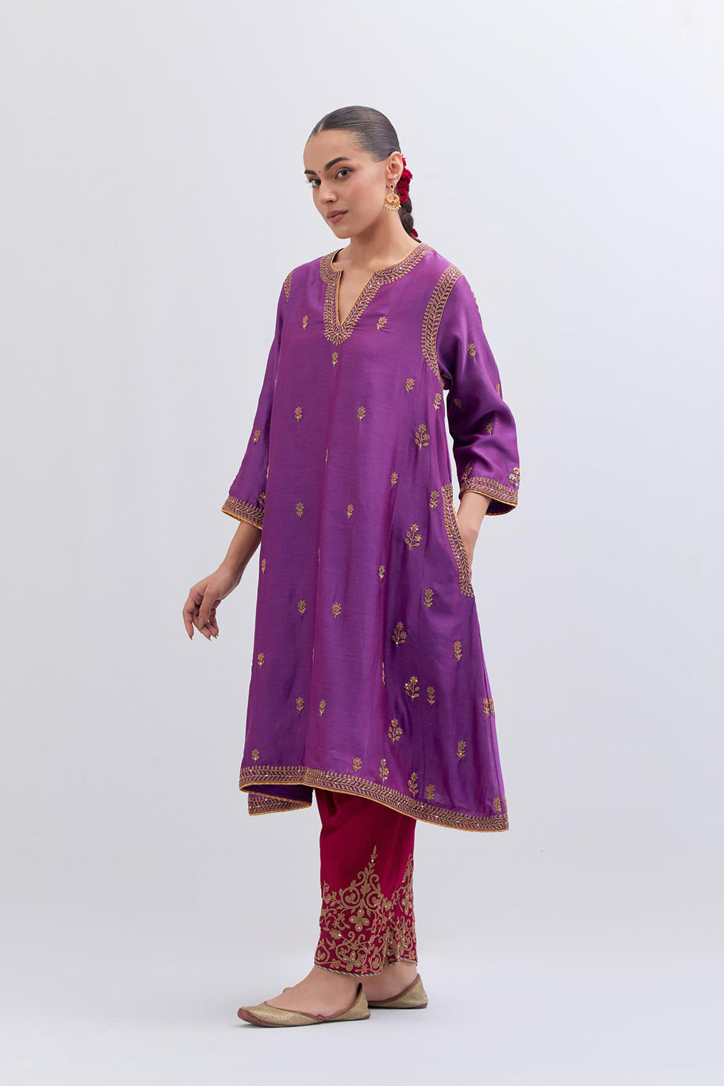 Purple Silk Chanderi A-line short kurta set with dull gold dori embroidery at neck, 3/4 sleeves, pockets and hem, highlighted with multi colored beads and gold sequins work.