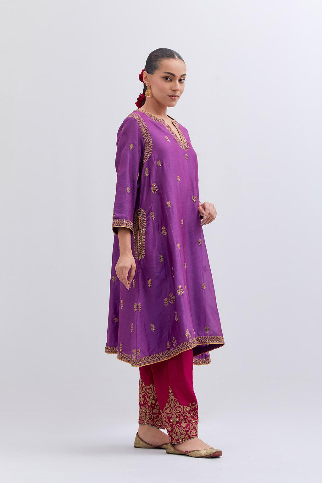 Purple Silk Chanderi A-line short kurta set with dull gold dori embroidery at neck, 3/4 sleeves, pockets and hem, highlighted with multi colored beads and gold sequins work.