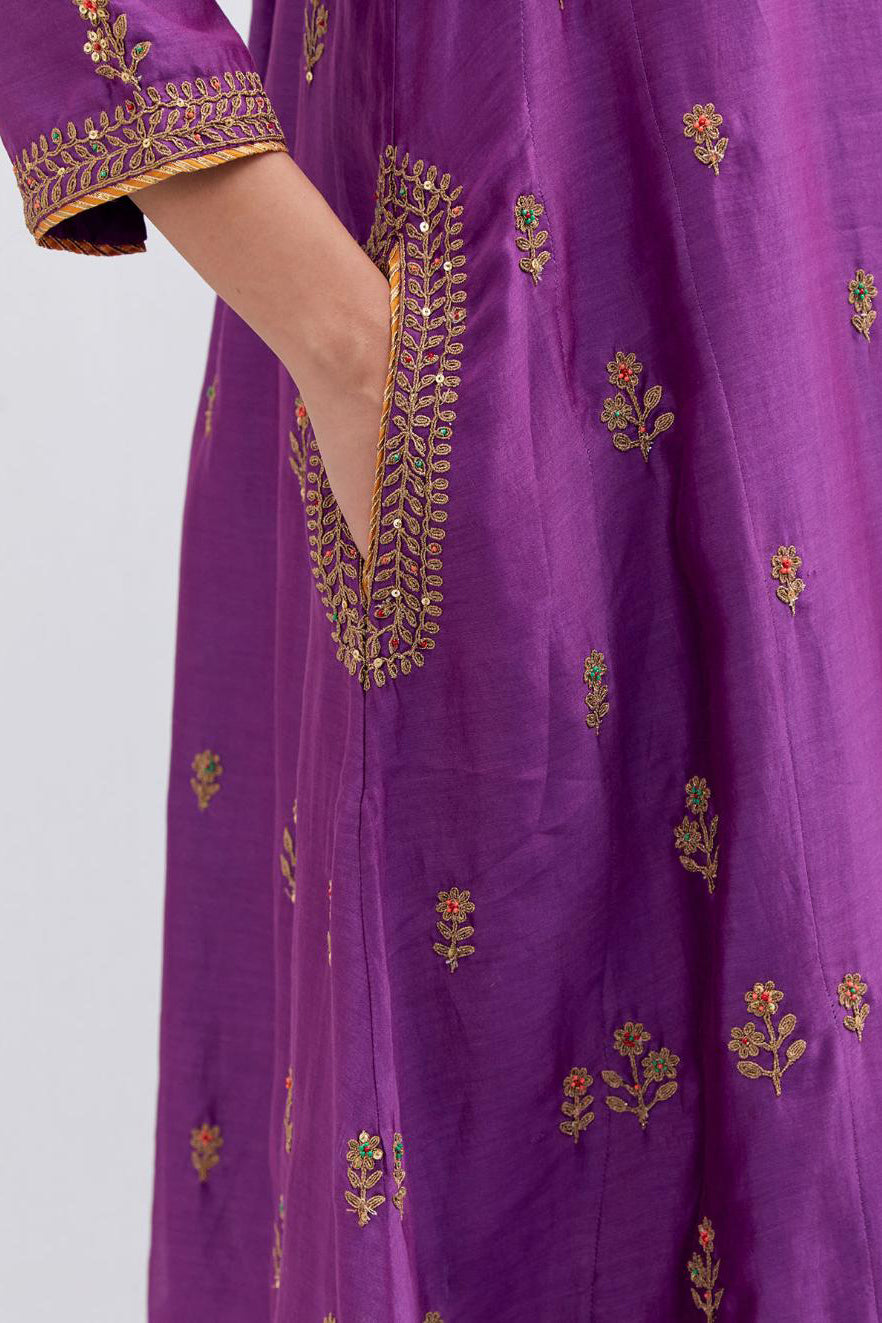 Purple Silk Chanderi A-line short kurta set with dull gold dori embroidery at neck, 3/4 sleeves, pockets and hem, highlighted with multi colored beads and gold sequins work.