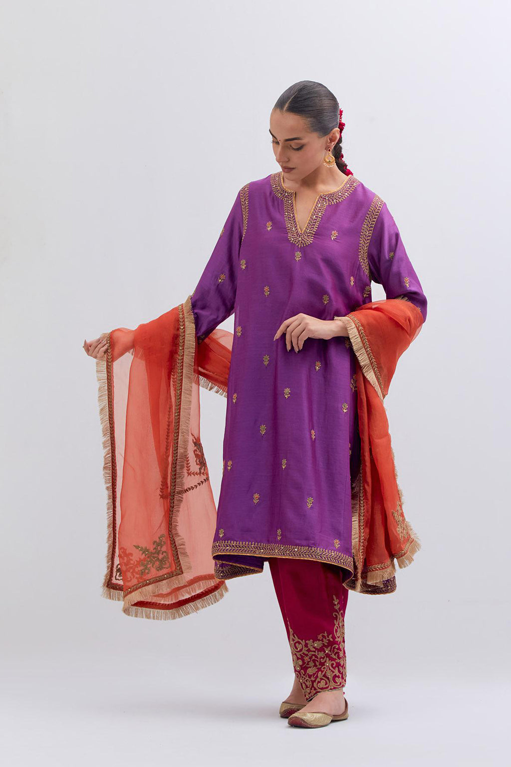 Purple Silk Chanderi A-line short kurta set with dull gold dori embroidery at neck, 3/4 sleeves, pockets and hem, highlighted with multi colored beads and gold sequins work.