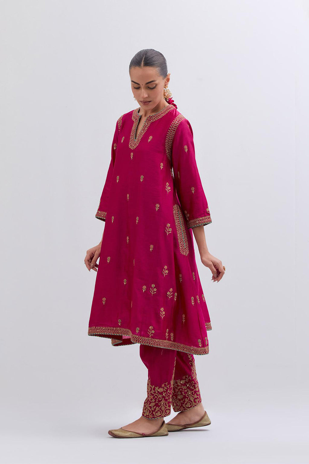 Fuchsia Silk Chanderi A-line short kurta set with dull gold dori embroidery at neck, 3/4 sleeves, pockets and hem, highlighted with multi colored beads and gold sequins work.