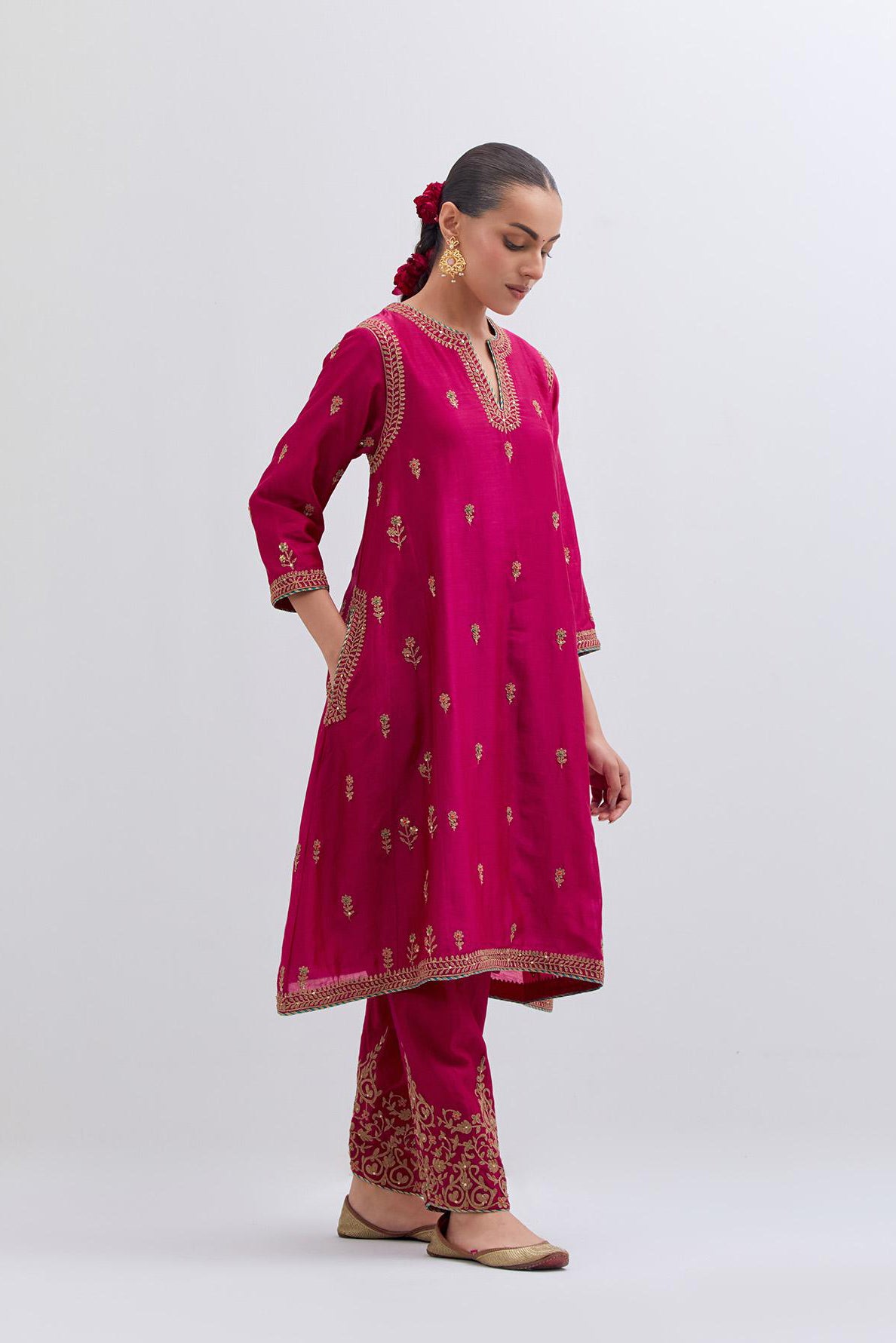 Fuchsia Silk Chanderi A-line short kurta set with dull gold dori embroidery at neck, 3/4 sleeves, pockets and hem, highlighted with multi colored beads and gold sequins work.