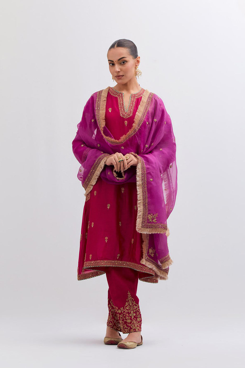 Fuchsia Silk Chanderi A-line short kurta set with dull gold dori embroidery at neck, 3/4 sleeves, pockets and hem, highlighted with multi colored beads and gold sequins work.
