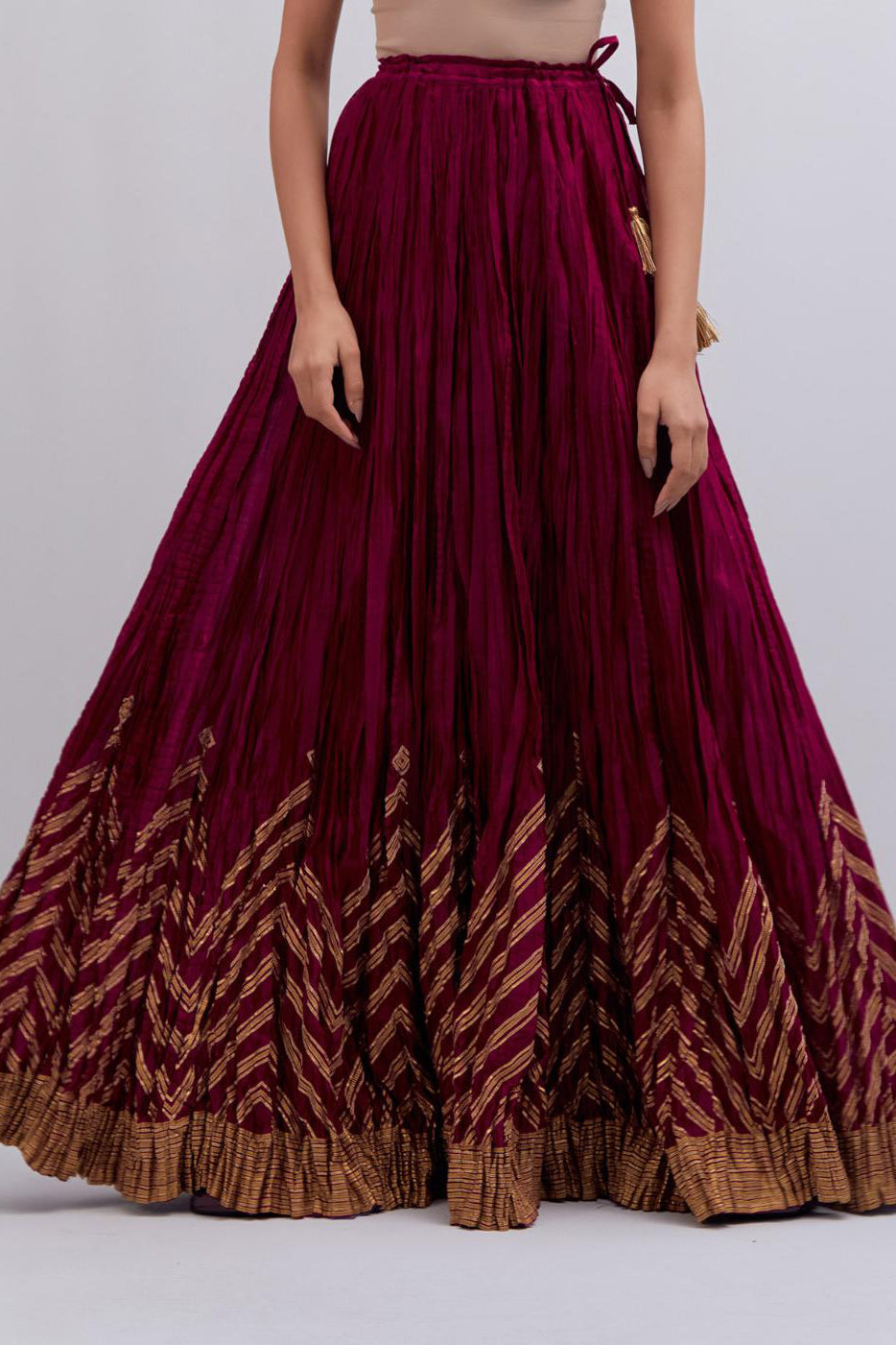 Chanderi 40 kali lehenga edged with dull gold gota embroidery and contrast chanderi facings.