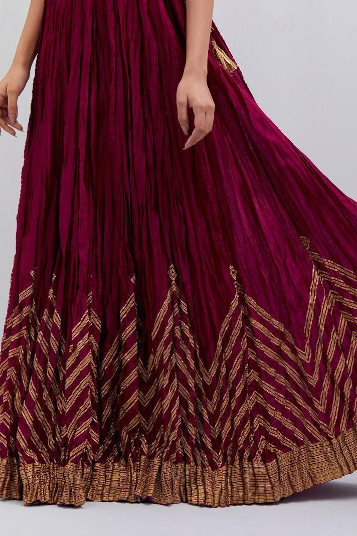 Chanderi 40 kali lehenga edged with dull gold gota embroidery and contrast chanderi facings.