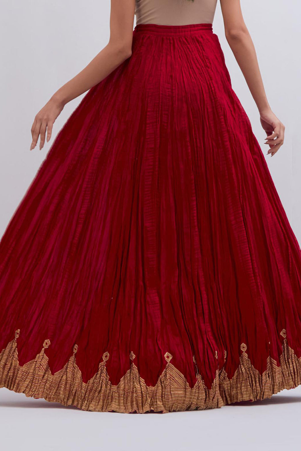 Chanderi 40 kali lehenga edged with dull gold gota embroidery and contrast chanderi facings.