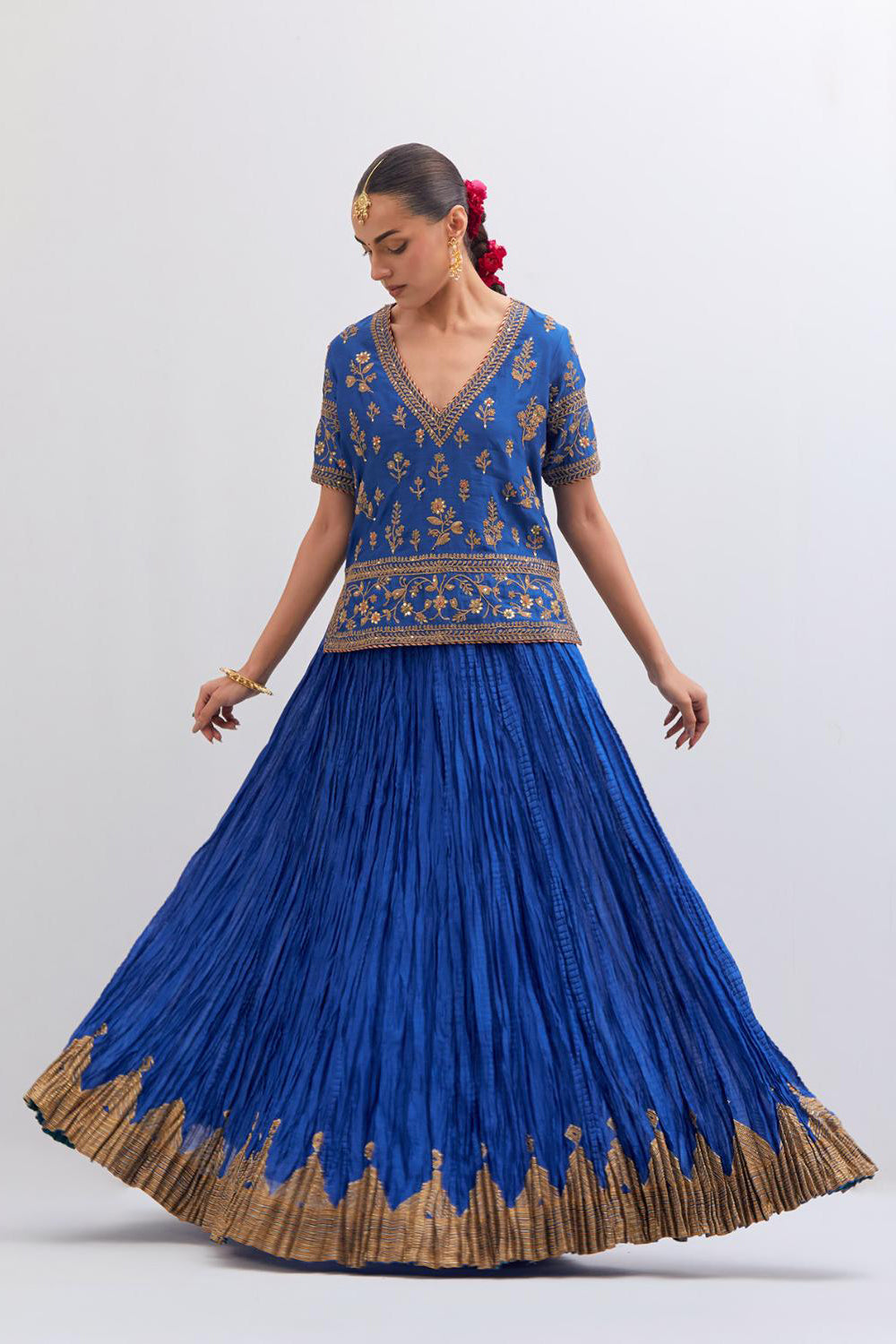 Chelsea Blue Silk Chanderi long choli set with all-over dull gold dori embroidery, highlighted with multi colored beads and gold sequins work.