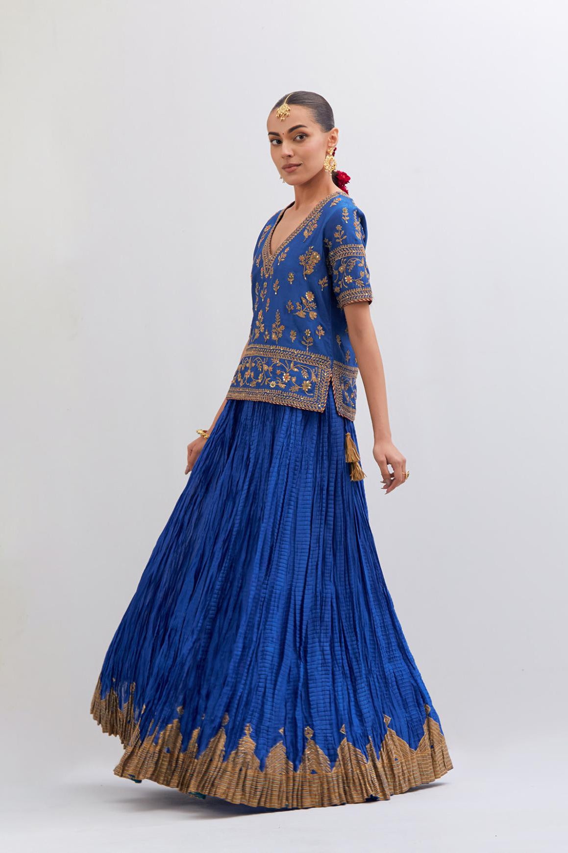 Chelsea Blue Silk Chanderi long choli set with all-over dull gold dori embroidery, highlighted with multi colored beads and gold sequins work.