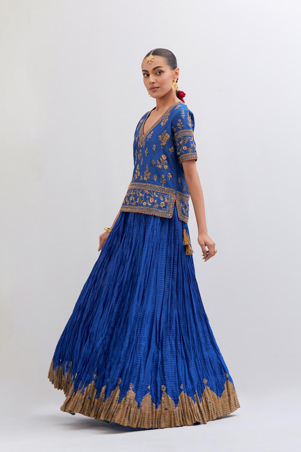 Chelsea Blue Silk Chanderi long choli set with all-over dull gold dori embroidery, highlighted with multi colored beads and gold sequins work.