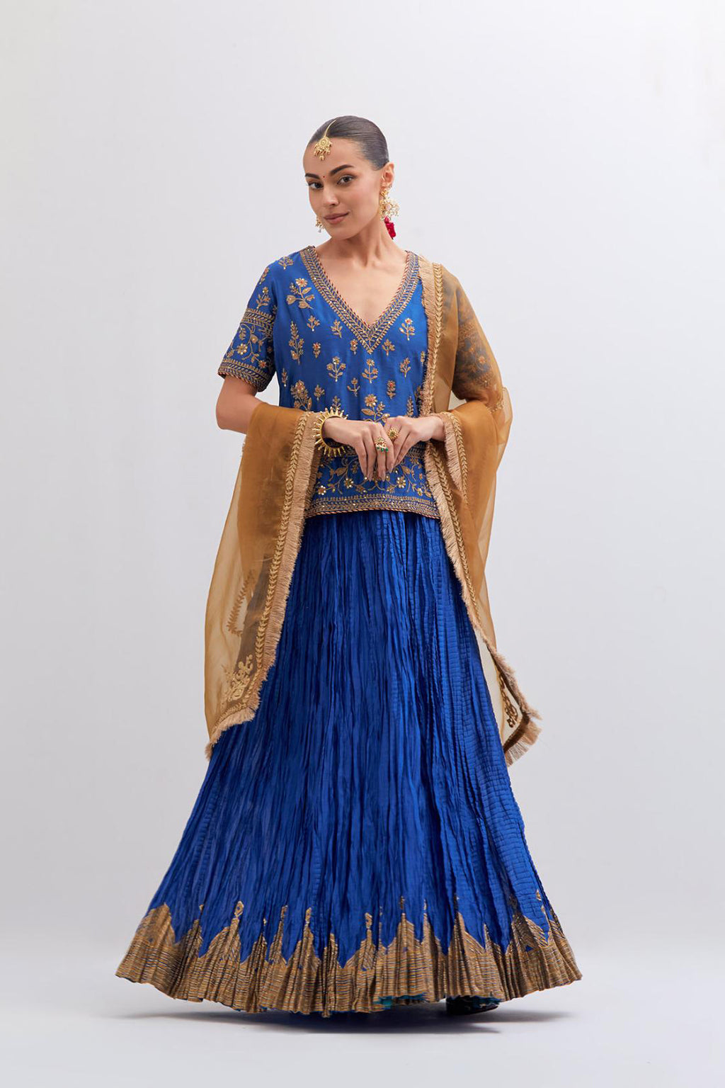 Chelsea Blue Silk Chanderi long choli set with all-over dull gold dori embroidery, highlighted with multi colored beads and gold sequins work.