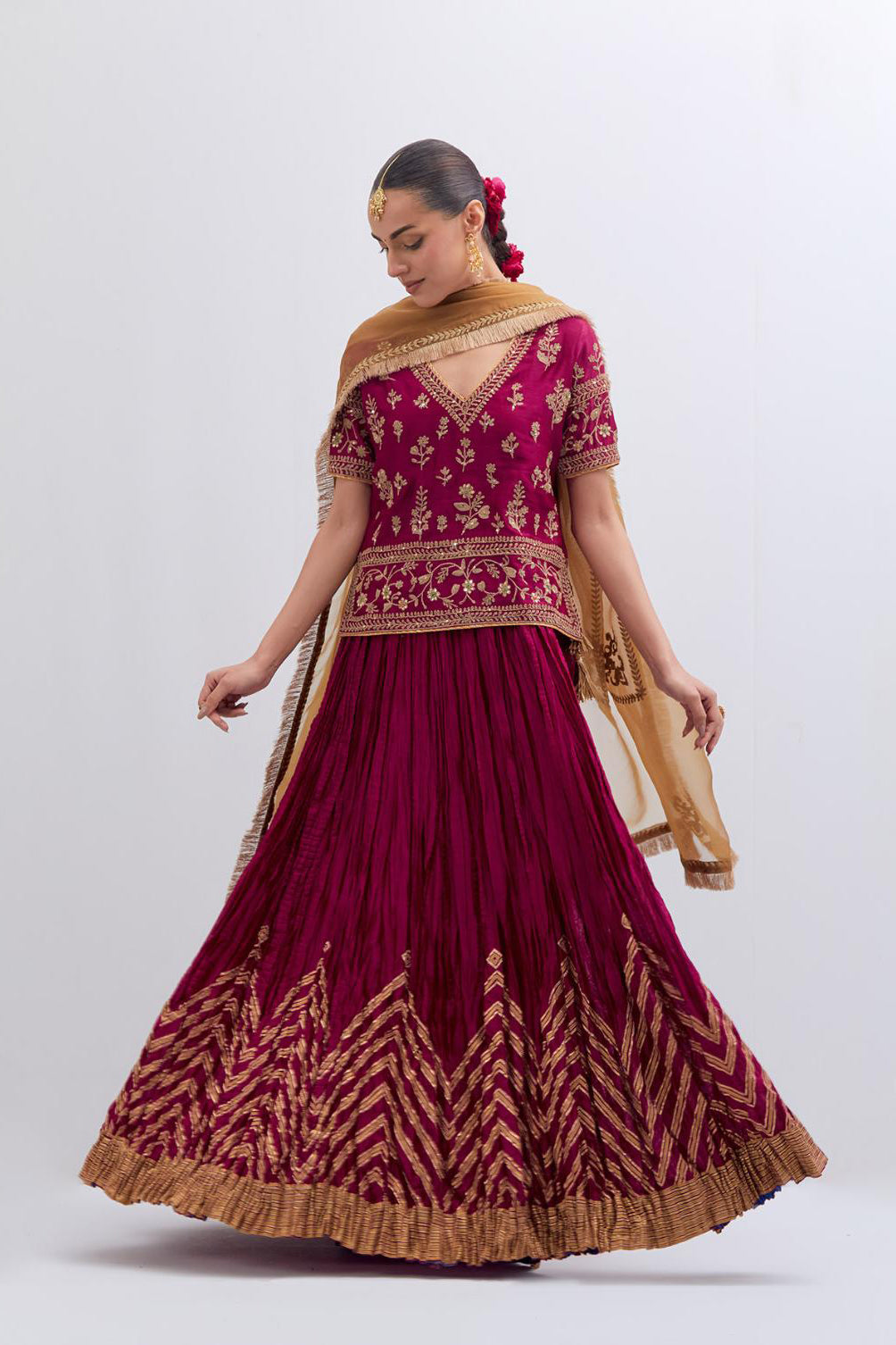 Deep Fuchsia Silk Chanderi long choli set with all-over dull gold dori embroidery, highlighted with multi colored beads and gold sequins work.