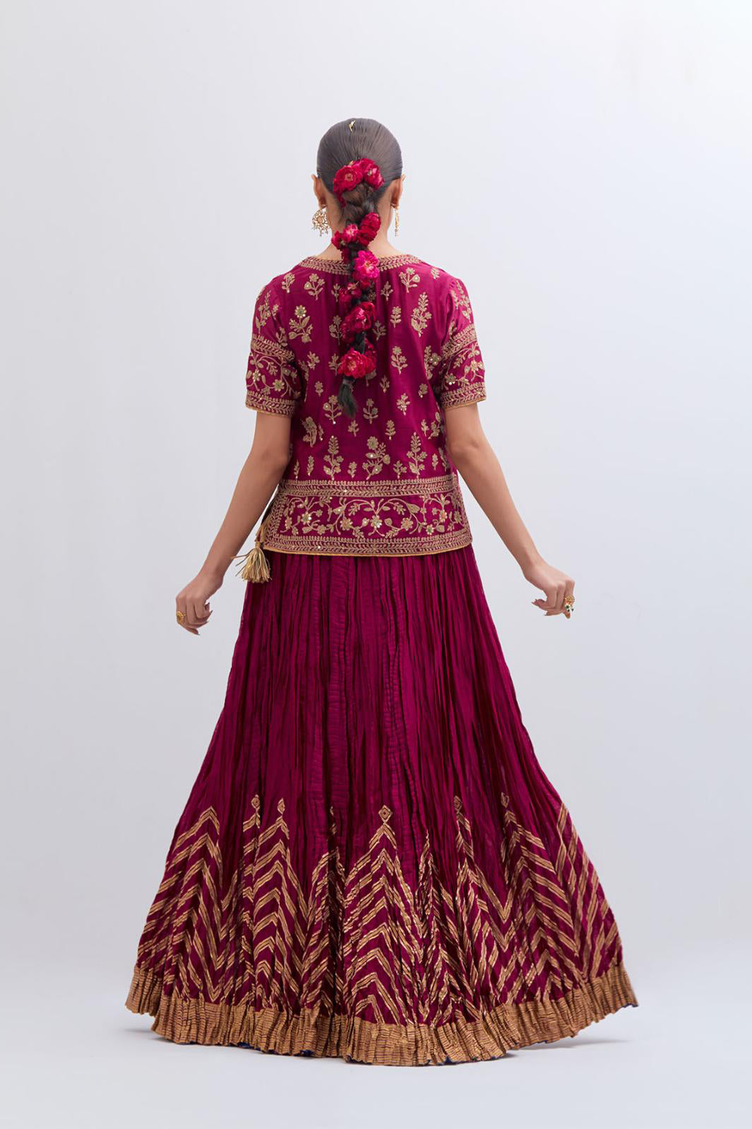Deep Fuchsia Silk Chanderi long choli set with all-over dull gold dori embroidery, highlighted with multi colored beads and gold sequins work.