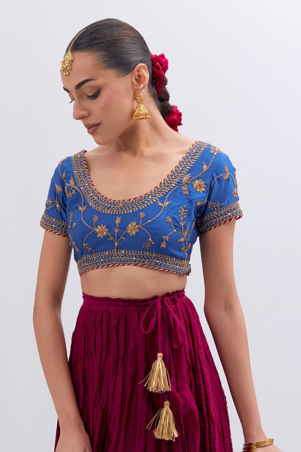Chelsea Blue Silk Chanderi choli set with all-over dull gold dori embroidery, highlighted with multi colored beads and gold sequins work.