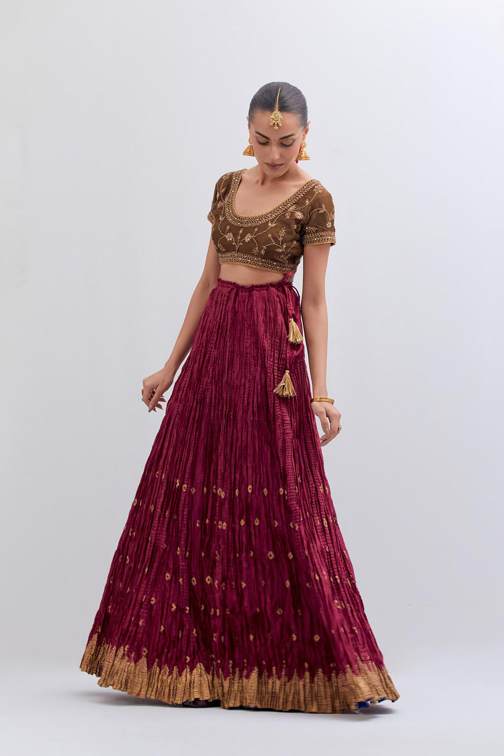 Olive Silk Chanderi choli set with all-over dull gold dori embroidery, highlighted with multi colored beads and gold sequins work.