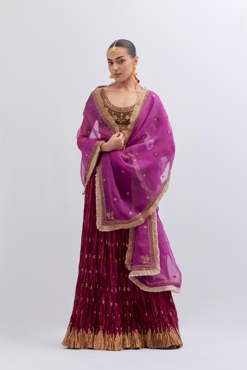 Olive Silk Chanderi choli set with all-over dull gold dori embroidery, highlighted with multi colored beads and gold sequins work.