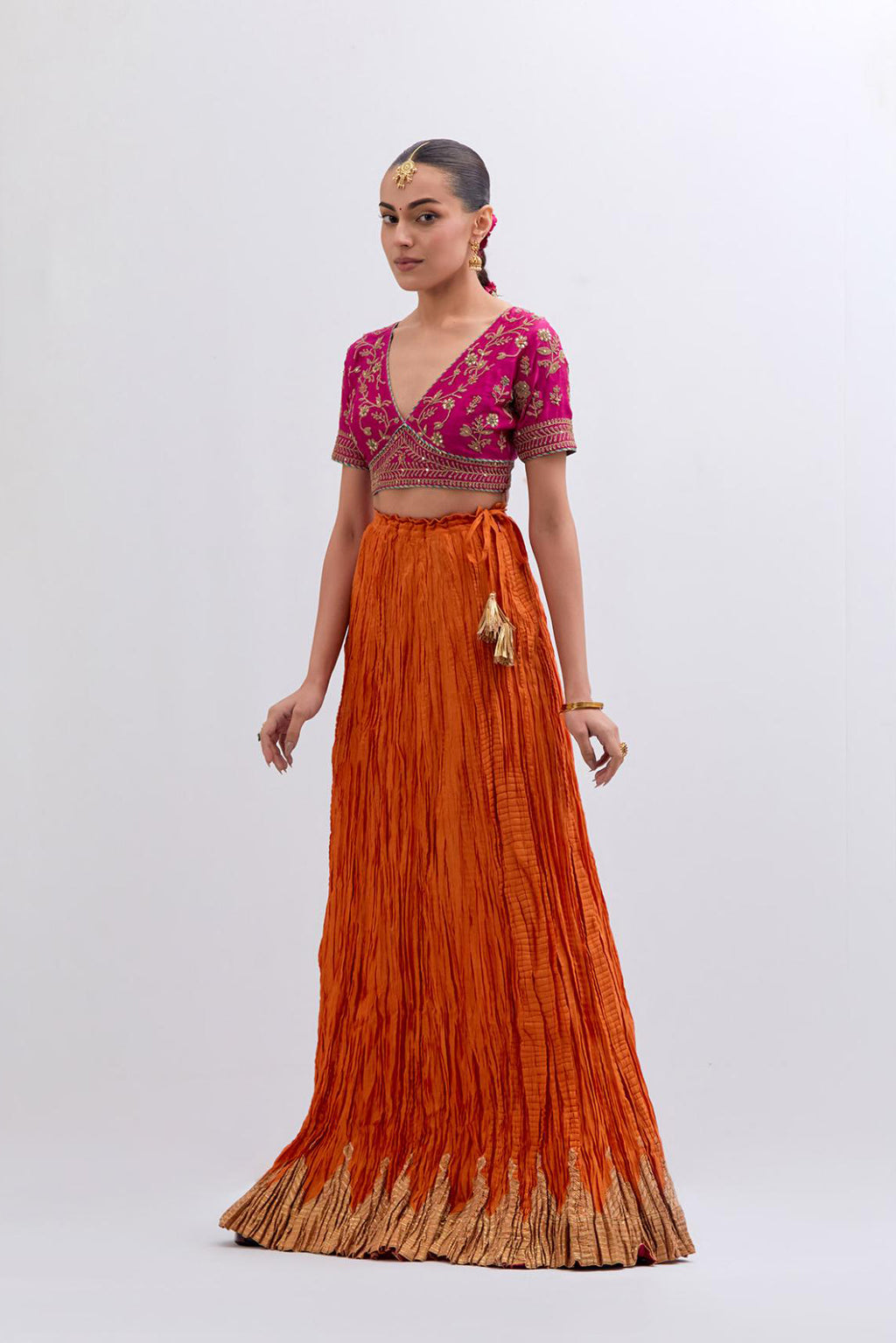 Fuchsia Silk Chanderi Choli set with all-over dull gold dori embroidery, highlighted with multi colored beads and gold sequins work.