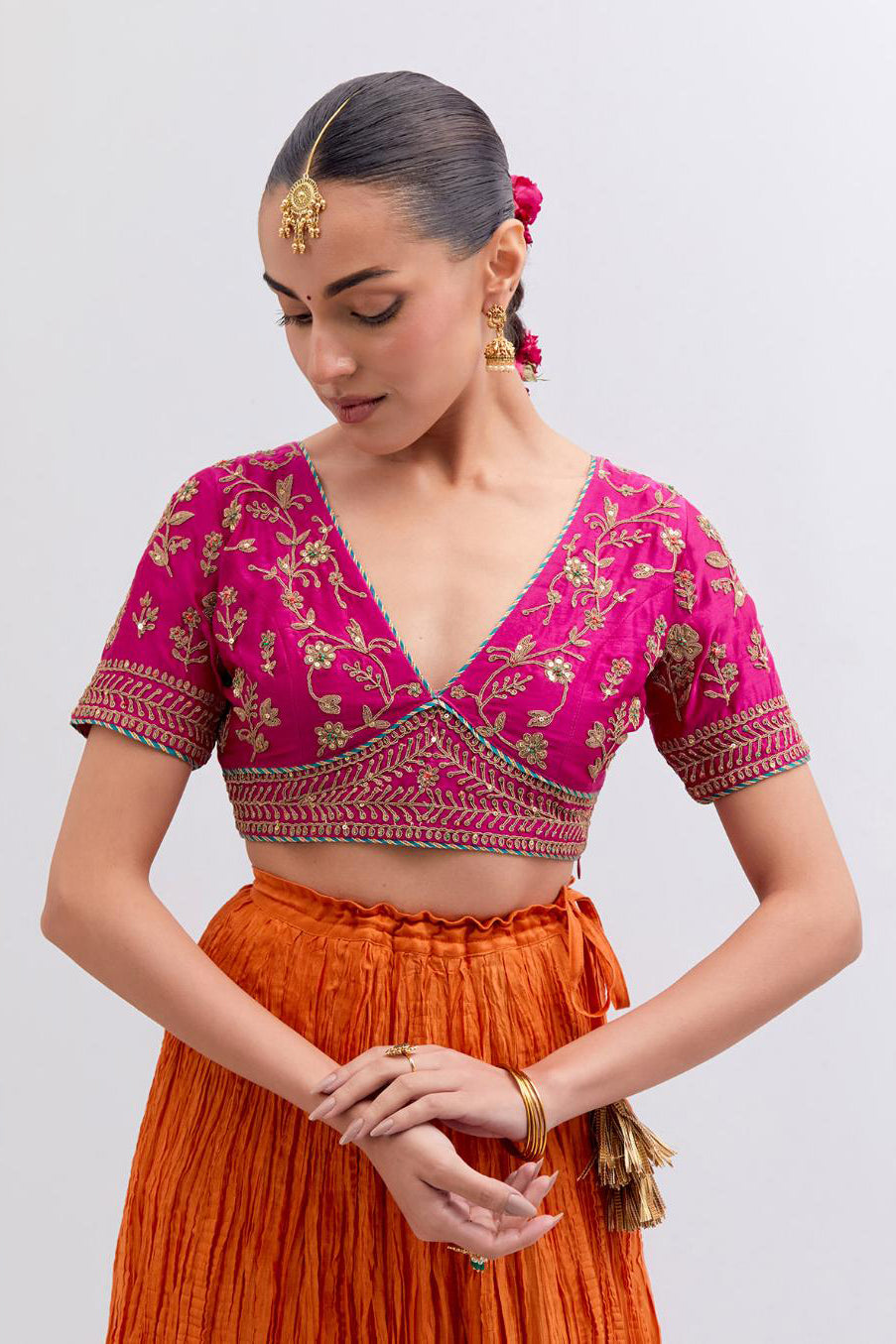 Fuchsia Silk Chanderi Choli set with all-over dull gold dori embroidery, highlighted with multi colored beads and gold sequins work.