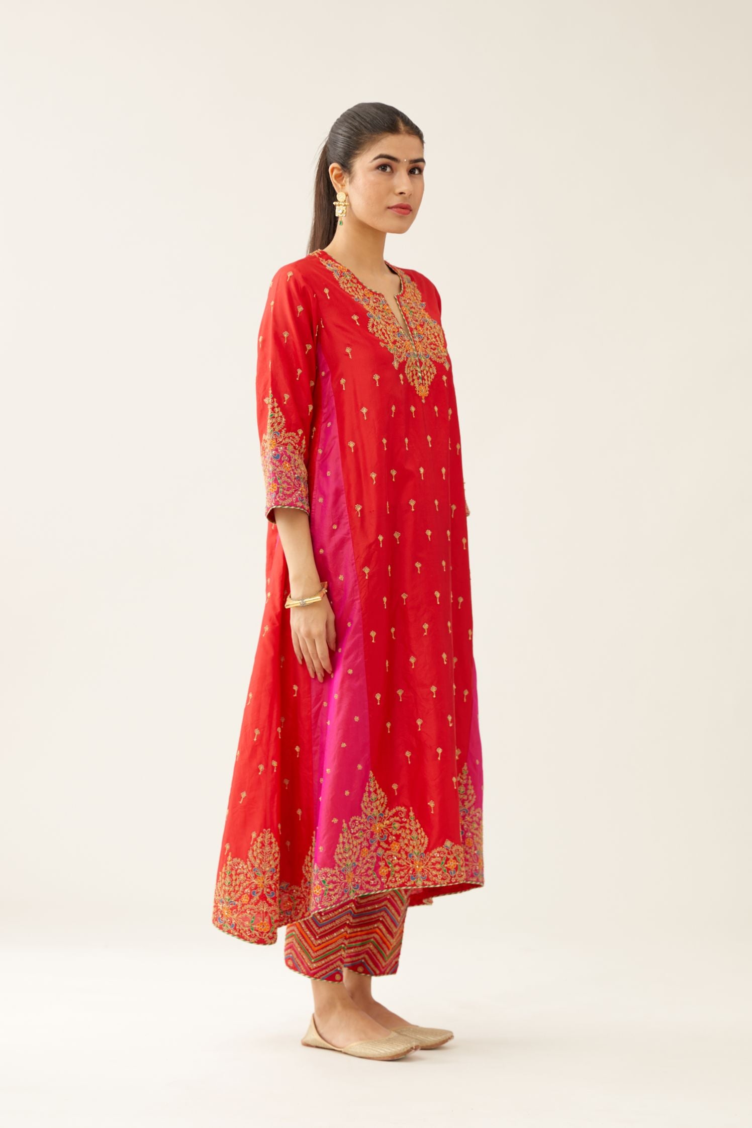 Red & fuchsia silk kalidar kurta set with all over dori & silk thread embroidery, highlighted with contrast bead & sequins work.