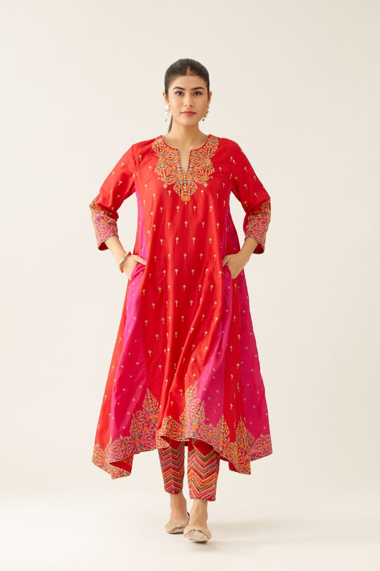 Red & fuchsia silk kalidar kurta set with all over dori & silk thread embroidery, highlighted with contrast bead & sequins work.