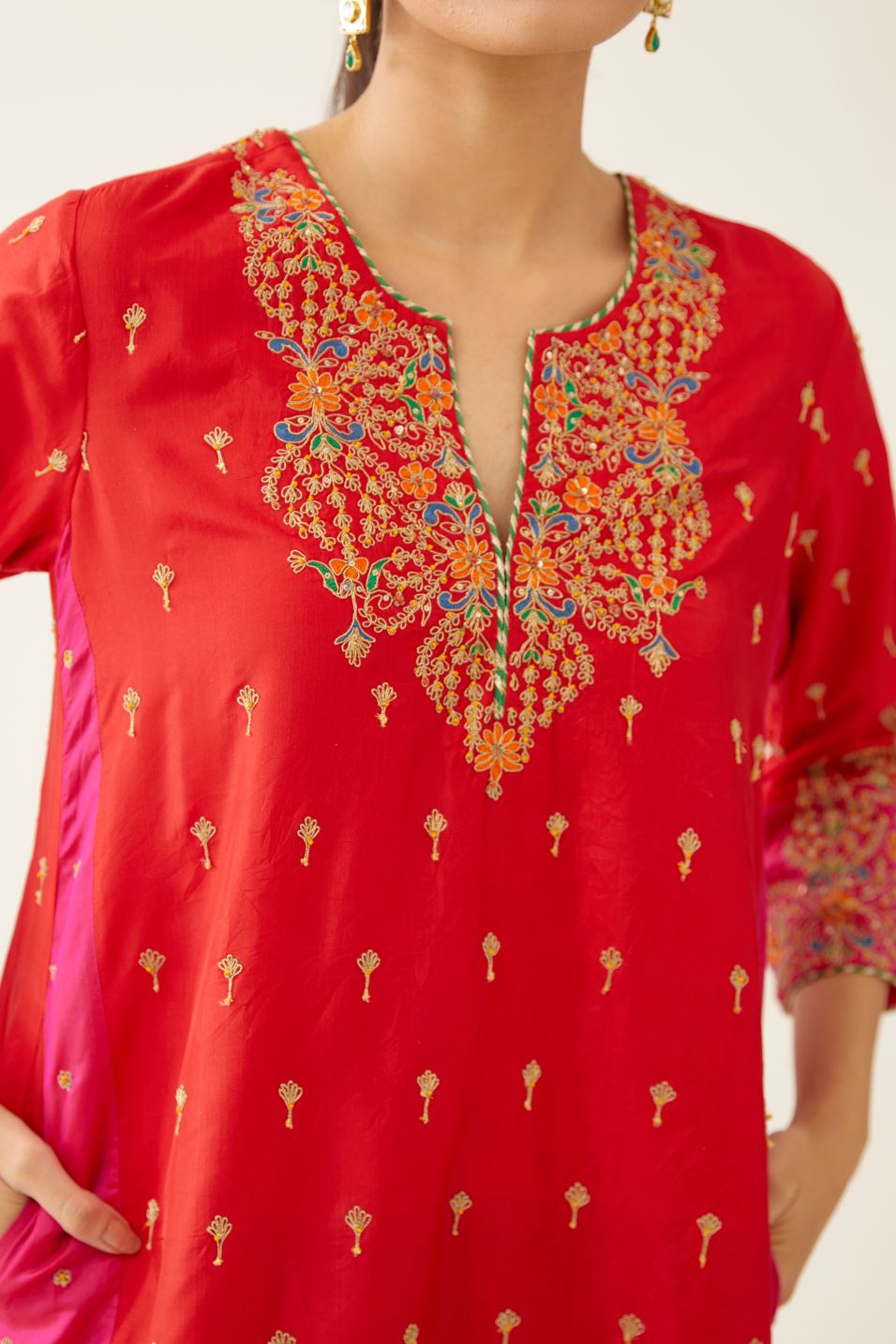 Red & fuchsia silk kalidar kurta set with all over dori & silk thread embroidery, highlighted with contrast bead & sequins work.