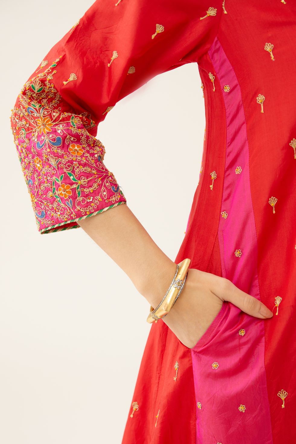 Red & fuchsia silk kalidar kurta set with all over dori & silk thread embroidery, highlighted with contrast bead & sequins work.