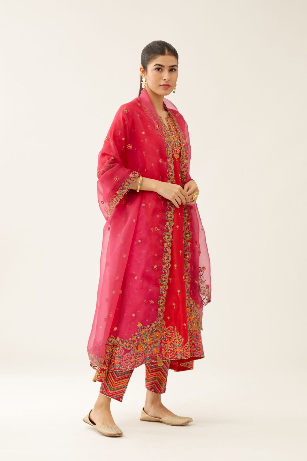 Red & fuchsia silk kalidar kurta set with all over dori & silk thread embroidery, highlighted with contrast bead & sequins work.