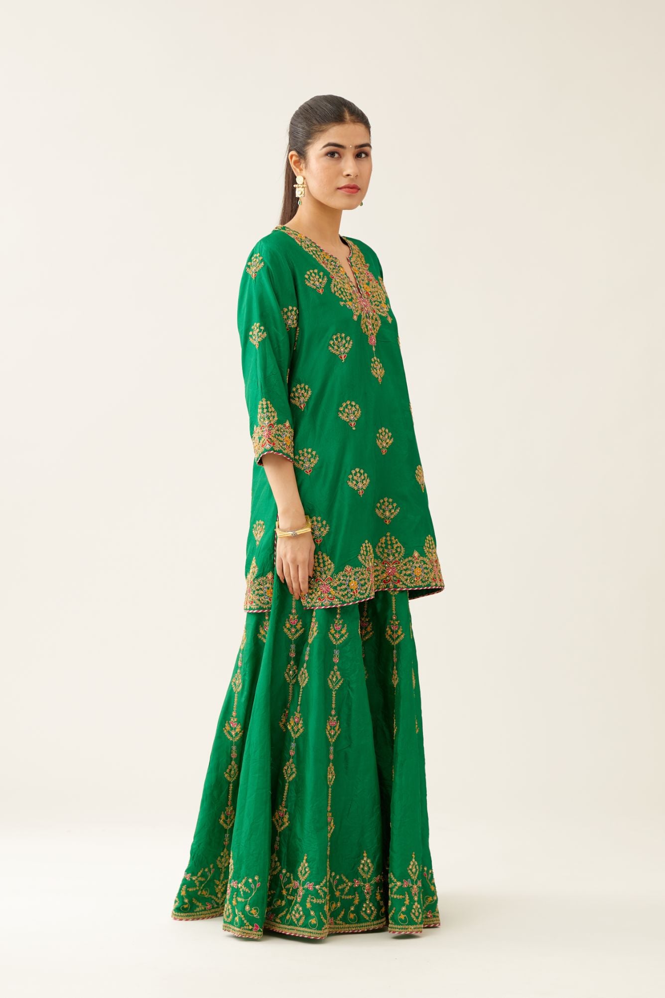 Green silk short kurta set, with dori & silk thread embroidery highlighted with contrast bead & sequins work.