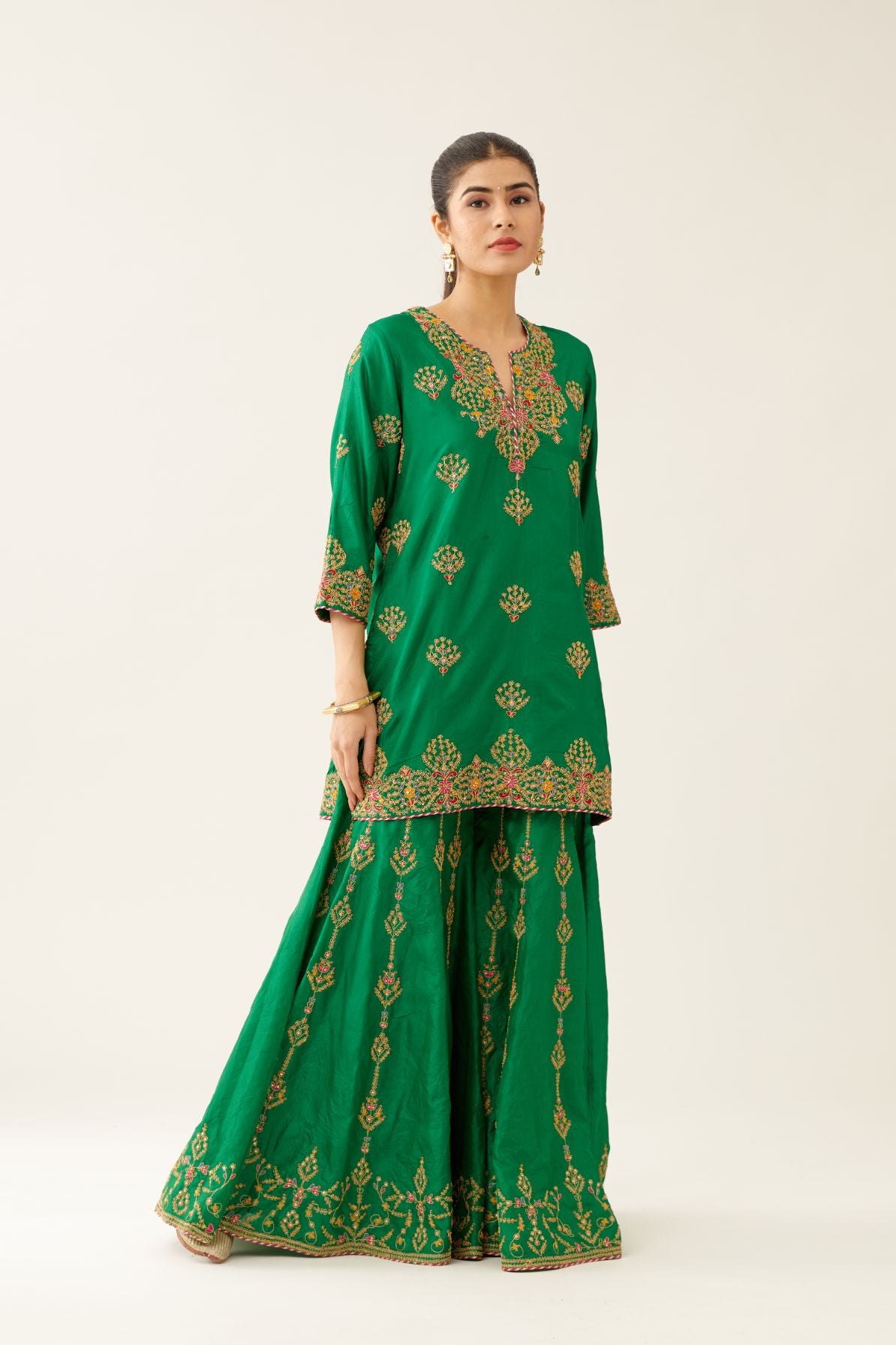Green silk short kurta set, with dori & silk thread embroidery highlighted with contrast bead & sequins work.