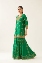Green silk short kurta set, with dori & silk thread embroidery highlighted with contrast bead & sequins work.